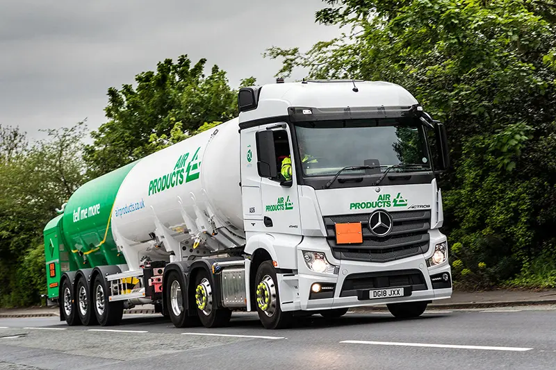White Air Products Tanker Truck Driving on a Road